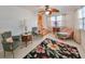 Bright living room with floral rug and antique furniture at 723 Ornelda Sw St, Ruskin, FL 33570