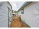 Wooden walkway next to home and storage shed at 723 Ornelda Sw St, Ruskin, FL 33570
