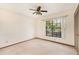 Simple bedroom with window and ceiling fan at 8504 Yearling Ln, New Port Richey, FL 34653