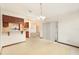 Simple dining room with a view into the living room and kitchen at 8504 Yearling Ln, New Port Richey, FL 34653