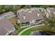 Aerial view showcasing condo building and backyard patio at 8647 Fancy Finch Dr # 203, Tampa, FL 33614