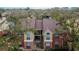 Aerial view of condo building with brick and yellow siding at 8647 Fancy Finch Dr # 203, Tampa, FL 33614