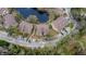 Top-down view of condo community near pond and parking at 8647 Fancy Finch Dr # 203, Tampa, FL 33614