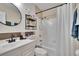 Clean bathroom with shower/tub combo and updated vanity at 8647 Fancy Finch Dr # 203, Tampa, FL 33614