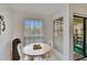 Bright breakfast nook with a small table and chairs at 8647 Fancy Finch Dr # 203, Tampa, FL 33614