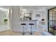 Modern kitchen with breakfast bar, white cabinets, and tiled backsplash at 8647 Fancy Finch Dr # 203, Tampa, FL 33614
