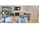 Cozy living room with fireplace, TV, and balcony access at 8647 Fancy Finch Dr # 203, Tampa, FL 33614
