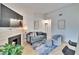 Living area with fireplace, comfy seating, and hardwood floors at 8647 Fancy Finch Dr # 203, Tampa, FL 33614