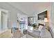 Open living room with kitchen view, fireplace, and balcony access at 8647 Fancy Finch Dr # 203, Tampa, FL 33614