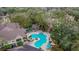 Community pool and deck with gazebo and lush landscaping at 8647 Fancy Finch Dr # 203, Tampa, FL 33614
