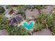 Aerial view of the community pool area with surrounding buildings at 8647 Fancy Finch Dr # 203, Tampa, FL 33614