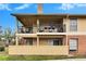 Ground floor condo with private balcony, patio furniture, and grilling area at 8647 Fancy Finch Dr # 203, Tampa, FL 33614
