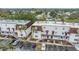 Aerial view of two-story building with parking and surrounding landscape at 9119 Tudor Dr # E201, Tampa, FL 33615