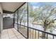 Screened balcony overlooking a tranquil waterway at 9119 Tudor Dr # E201, Tampa, FL 33615