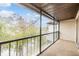 Private screened balcony with treetop views at 9119 Tudor Dr # E201, Tampa, FL 33615