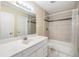 Clean bathroom with a bathtub, shower, and single sink vanity at 9119 Tudor Dr # E201, Tampa, FL 33615