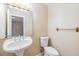 Clean bathroom with pedestal sink and toilet at 9119 Tudor Dr # E201, Tampa, FL 33615
