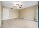 Spacious bedroom with ceiling fan and tile floors at 9119 Tudor Dr # E201, Tampa, FL 33615
