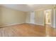 Large bedroom with wood-look floors and access to bathroom at 9119 Tudor Dr # E201, Tampa, FL 33615