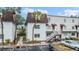 Two-story condo building with a brown roof and white exterior at 9119 Tudor Dr # E201, Tampa, FL 33615