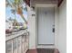 White front door with a balcony view of the parking lot at 9119 Tudor Dr # E201, Tampa, FL 33615