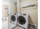 Laundry closet with washer and dryer included at 9119 Tudor Dr # E201, Tampa, FL 33615