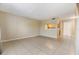 Spacious living room with tile floors and kitchen view at 9119 Tudor Dr # E201, Tampa, FL 33615