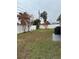 Backyard with a white fence, small trees, and a patio area at 10879 91St Ave, Seminole, FL 33772