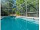 Refreshing screened pool and spa perfect for summer enjoyment at 110 Deerpath Dr, Oldsmar, FL 34677