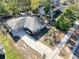 Single-story home nestled amongst lush trees at 1116 E Boyer St, Tarpon Springs, FL 34689