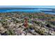 Aerial view of home near lake and other houses at 1116 E Boyer St, Tarpon Springs, FL 34689