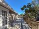 Large deck with white french doors leading to the home and a view of the backyard at 1116 E Boyer St, Tarpon Springs, FL 34689