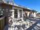 Large deck with white french doors leading to the home and a view of the backyard at 1116 E Boyer St, Tarpon Springs, FL 34689