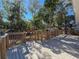 Deck with stairs leading to the backyard and wooden railings at 1116 E Boyer St, Tarpon Springs, FL 34689