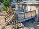 Home features a spacious back deck with wooden railings, stairs, and access from multiple doors at 1116 E Boyer St, Tarpon Springs, FL 34689