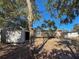 Backyard view of home with shed and trees at 1116 E Boyer St, Tarpon Springs, FL 34689