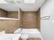 Bright bathroom featuring a shower/tub and updated vanity at 1116 E Boyer St, Tarpon Springs, FL 34689