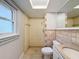 Bathroom with shower stall, toilet and vanity at 1116 E Boyer St, Tarpon Springs, FL 34689