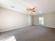 Bright bedroom with ceiling fan, carpet, and window at 1116 E Boyer St, Tarpon Springs, FL 34689