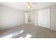 Bedroom with ceiling fan and double door closet at 1116 E Boyer St, Tarpon Springs, FL 34689