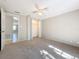 Bedroom with ceiling fan and double door closet at 1116 E Boyer St, Tarpon Springs, FL 34689