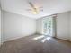 Spacious bedroom with french doors leading to a balcony at 1116 E Boyer St, Tarpon Springs, FL 34689