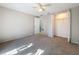 Bedroom with ceiling fan and double door closet at 1116 E Boyer St, Tarpon Springs, FL 34689