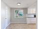 Well-lit dining room near kitchen with tile floors at 1116 E Boyer St, Tarpon Springs, FL 34689