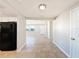 Bright entryway with tile flooring, leading to living areas and kitchen at 1116 E Boyer St, Tarpon Springs, FL 34689