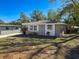 Well-maintained home with a large front yard and landscaping at 1116 E Boyer St, Tarpon Springs, FL 34689