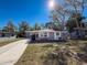 Nice curb appeal, freshly painted home with a spacious yard at 1116 E Boyer St, Tarpon Springs, FL 34689