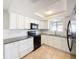 Updated kitchen, white cabinets, granite countertops at 1116 E Boyer St, Tarpon Springs, FL 34689