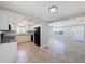 Bright kitchen with granite counters, white cabinets and black appliances at 1116 E Boyer St, Tarpon Springs, FL 34689