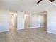 Open living room showcasing tile floors and hallway access at 1116 E Boyer St, Tarpon Springs, FL 34689